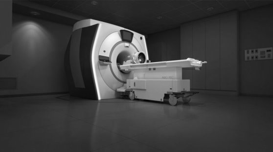 Гибридная операционная. Магнитно-резонансный томограф (кубической формы) и аппарат фокусированного ультразвука (округлой формы на столе)